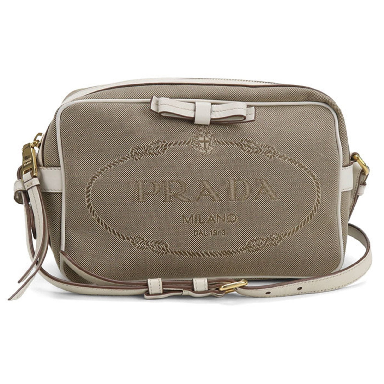 Jacquard shoulder bag by Prada: Jacquard shoulder bag by Prada The Prada Jacquard shoulder bag boasts a sophisticated design, featuring intricate patterns woven into its luxurious fabric. With a subtle beige hue and sleek lines, thi