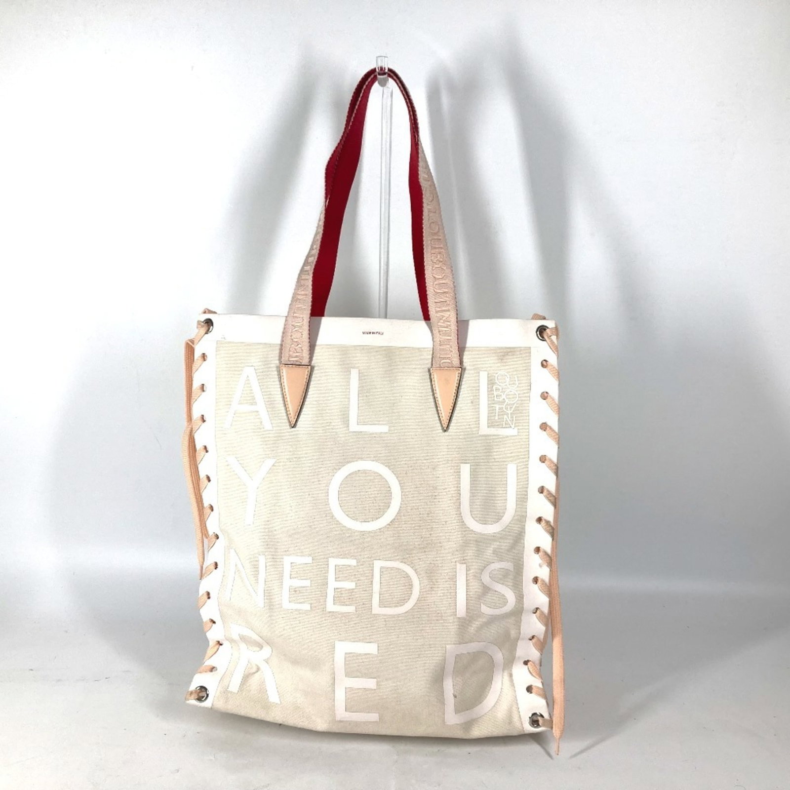 Canvas Leather Christian Louboutin Shoulder Bag Tote Bag: Canvas Leather Christian Louboutin Shoulder Bag Tote Bag Canvas Leather Christian Louboutin Shoulder Bag Tote Bag in Pink and White. This stylish shoulder bag features canvas and leather construction,