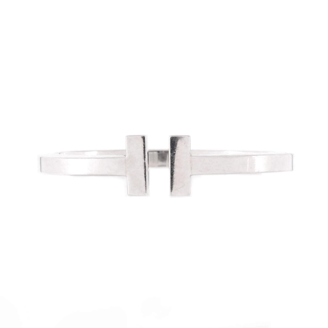 Tiffany Co T Square Bracelet Sterling Silver: Tiffany Co T Square Bracelet Sterling Silver Sterling Silver T Square Bracelet from Tiffany & Co. boasts a classic design with a silver finish, measuring 6.5" in circumference and 15" in width. This p