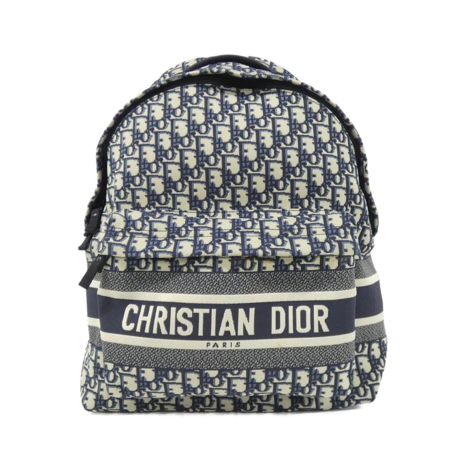 Canvas Backpack Christian Dior: Canvas Backpack Christian Dior Canvas Backpack in Blue by Christian Dior, featuring a classic design with canvas material and a signature blue hue. This used backpack has some minor scratches and