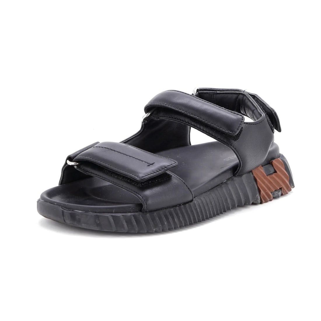 Junior Leather sandals women's Hermes: Junior Leather sandals women's Hermes Black leather junior sandals from Hermes, featuring palladium hardware and a classic design. The shoes show signs of wear, including creasing, scuffs, and