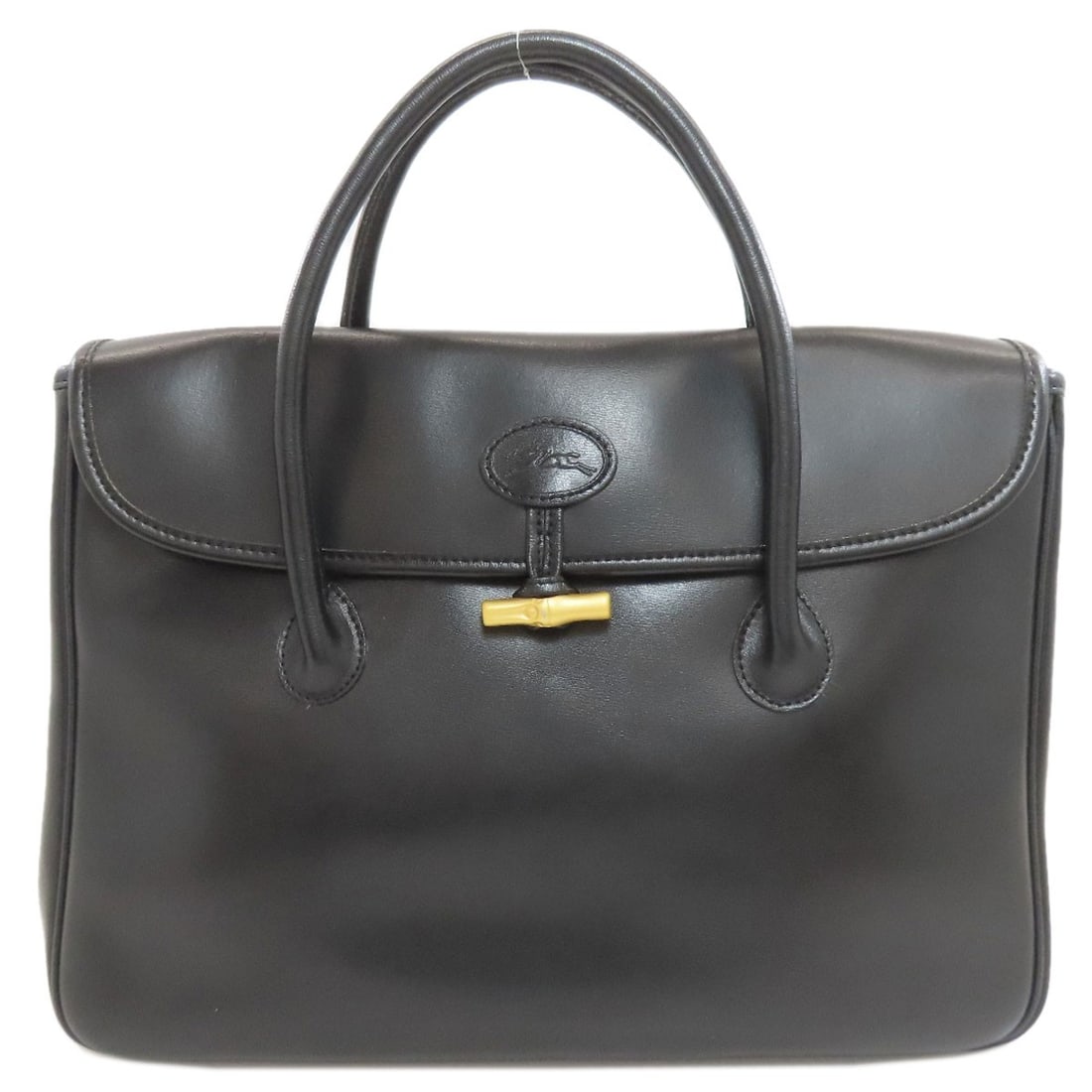 Longchamp Rozo Handbag Leather: Longchamp Rozo Handbag Leather Black leather Longchamp Rozo handbag. Made from high-quality leather, this stylish bag features a sleek design and black exterior color. The signature on the work bears