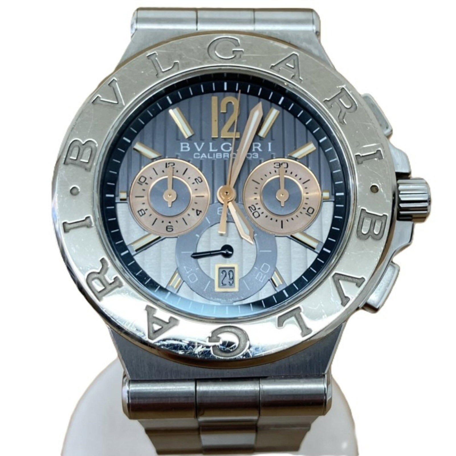 Bvlgari Wristwatch: Bvlgari Wristwatch Stainless steel case and band, measuring 47mm in diameter, make up the foundation of this Bvlgari wristwatch. The watch has been used, with traces of usage visible, including scratc