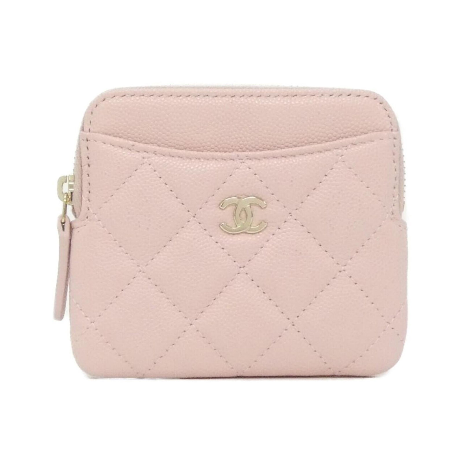 Chanel Coin Purse/ Coin Case Grained Calfskin: Chanel Coin Purse/ Coin Case Grained Calfskin The Chanel Coin Purse/ Coin Case Grained Calfskin features a light pink color and a classic design, crafted from high-quality grained calfskin. With its