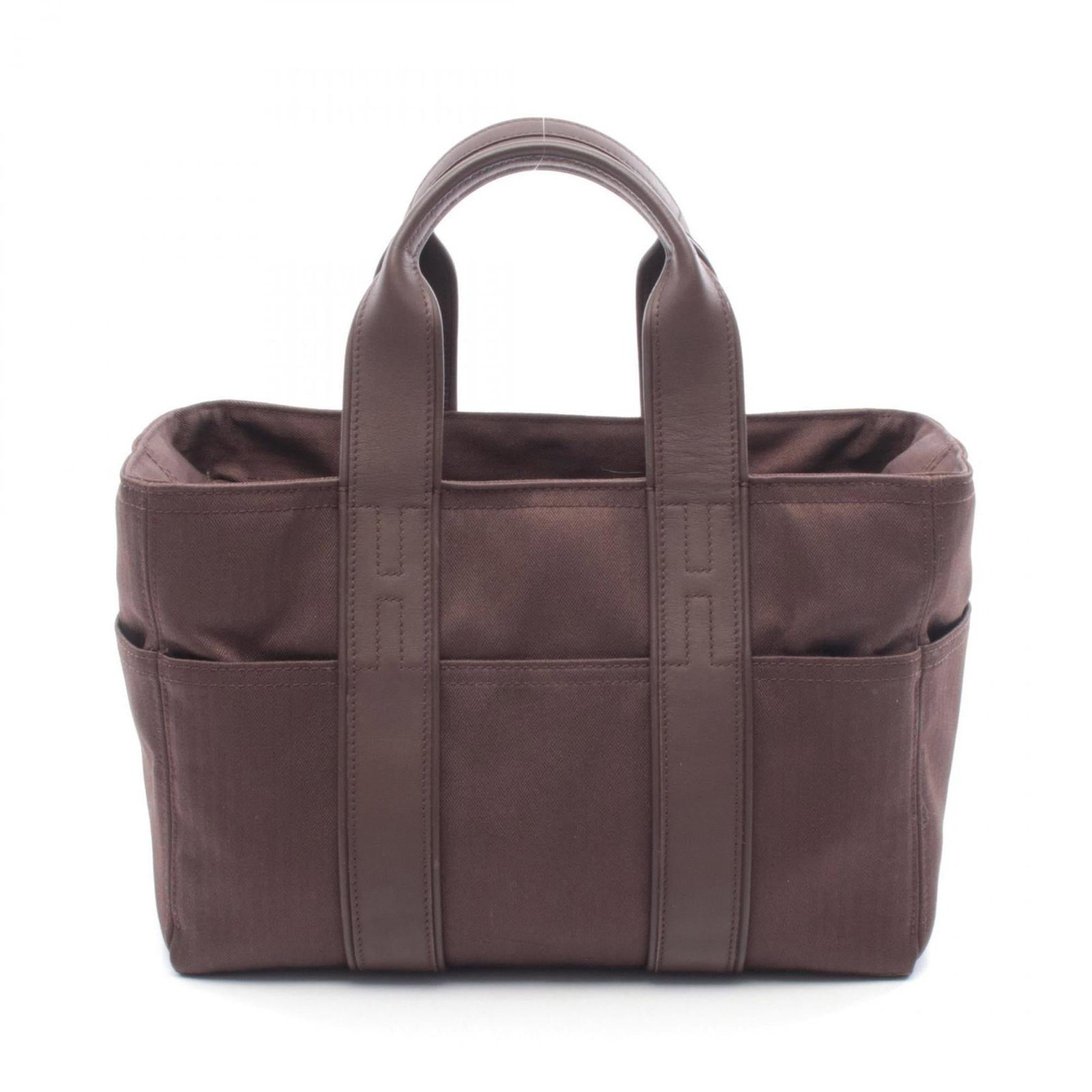 Hermes Handbag Canvas Leather: Hermes Handbag Canvas Leather Canvas and leather come together in this unique Herm?s handbag, featuring the iconic Toile Chevrons pattern. The brown color adds a touch of elegance to this versatile