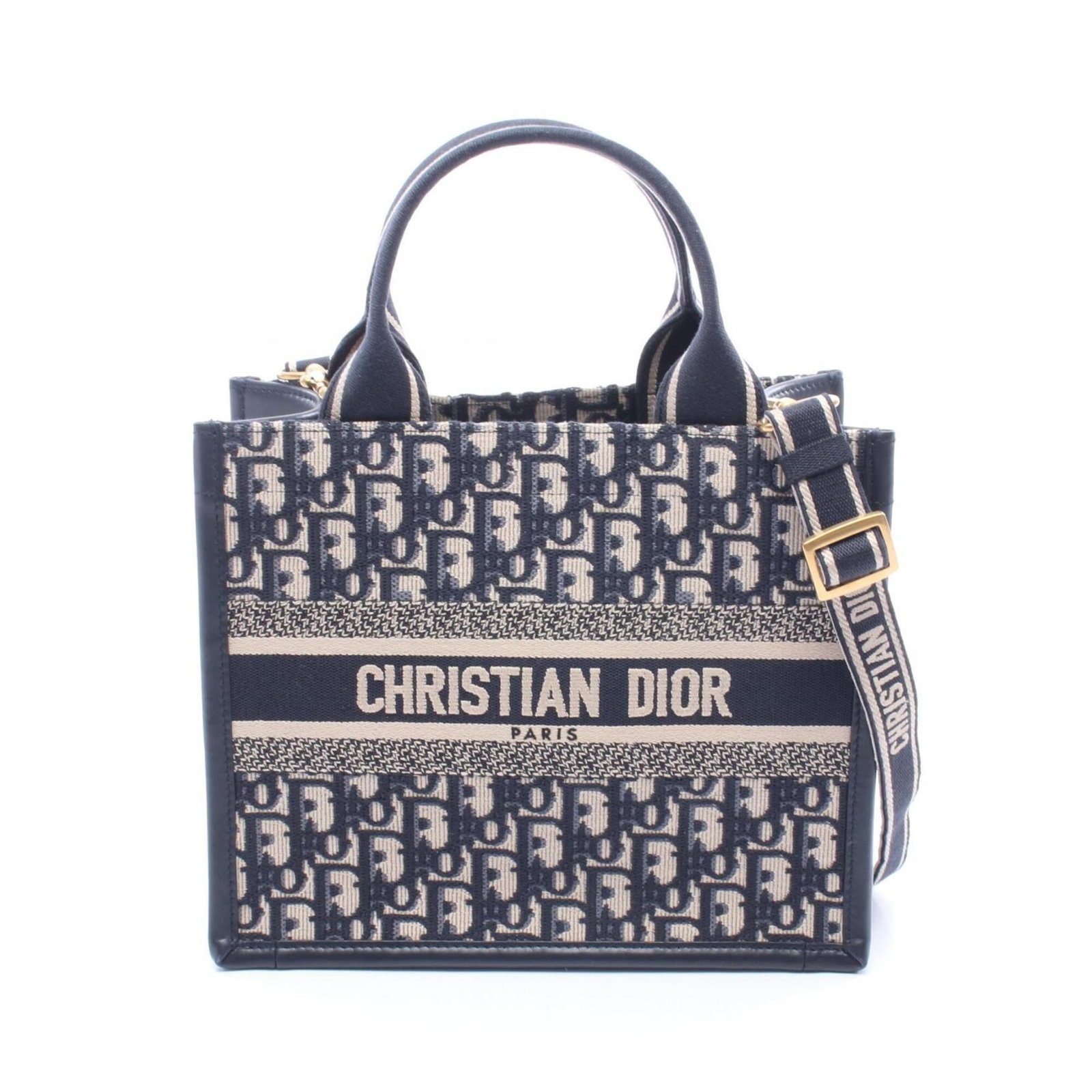Handbag Canvas Leather Dior Christian Tote: Handbag Canvas Leather Dior Christian Tote Canvas and leather blend in this classic Christian Dior tote, available in beige with navy accents. Measuring 22cm x 27cm x 13cm, it features a timeless