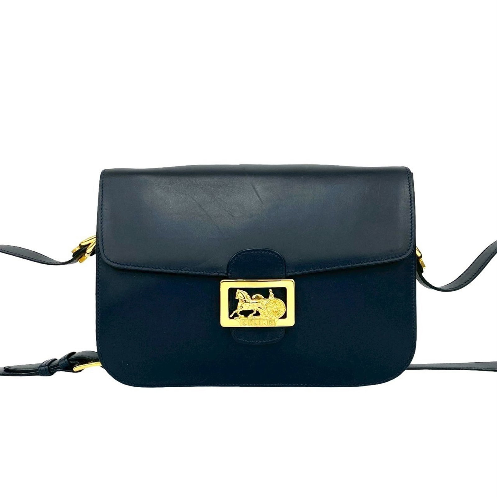 Celine Leather Pochette Bag: Celine Leather Pochette Bag Navy leather pochette bag with classic Celine design, featuring a timeless shoulder strap and subtle details. Measuring 18cm x 23cm x 5cm, it has been well-worn, showing
