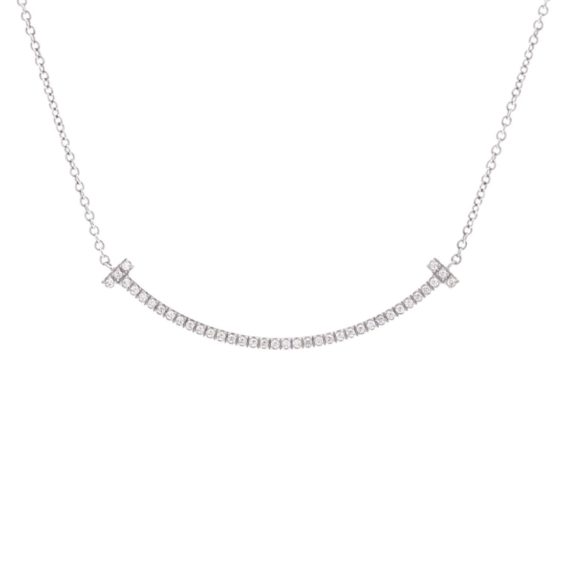 Tiffany & Co. T Smile Pendant Necklace 18K White Gold with Diamonds Small: Tiffany & Co. T Smile Pendant Necklace 18K White Gold with Diamonds Small 18K White Gold Tiffany & Co. T Smile Pendant Necklace with Diamonds measures 15.75 inches in length and features a small, 9.65