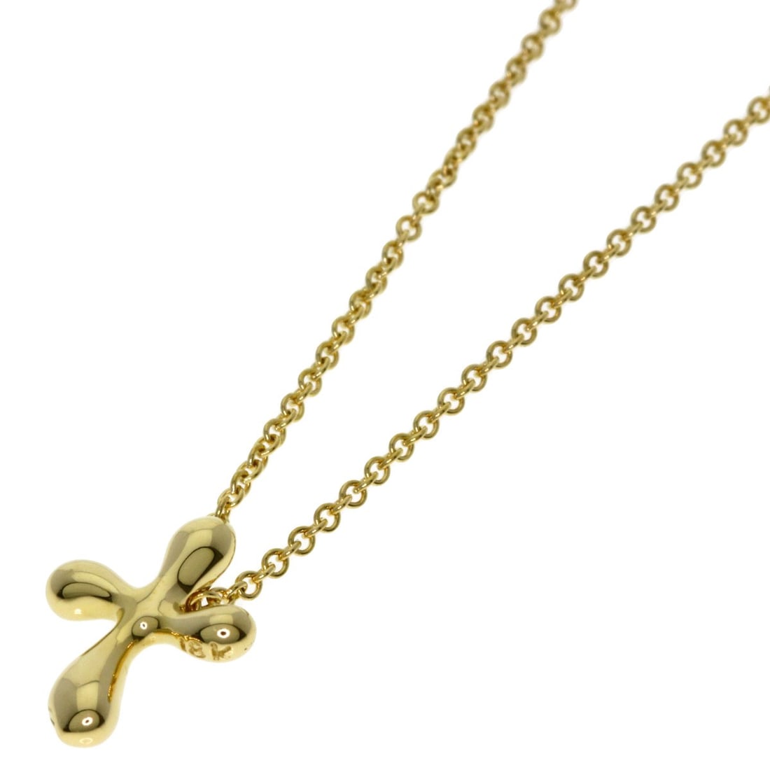 Tiffany and Co small cross necklace in K18 yellow gold: Tiffany and Co small cross necklace in K18 yellow gold K18 yellow gold necklace from Tiffany and Co, featuring a small cross design. This piece boasts exceptional craftsmanship with its K18 purity