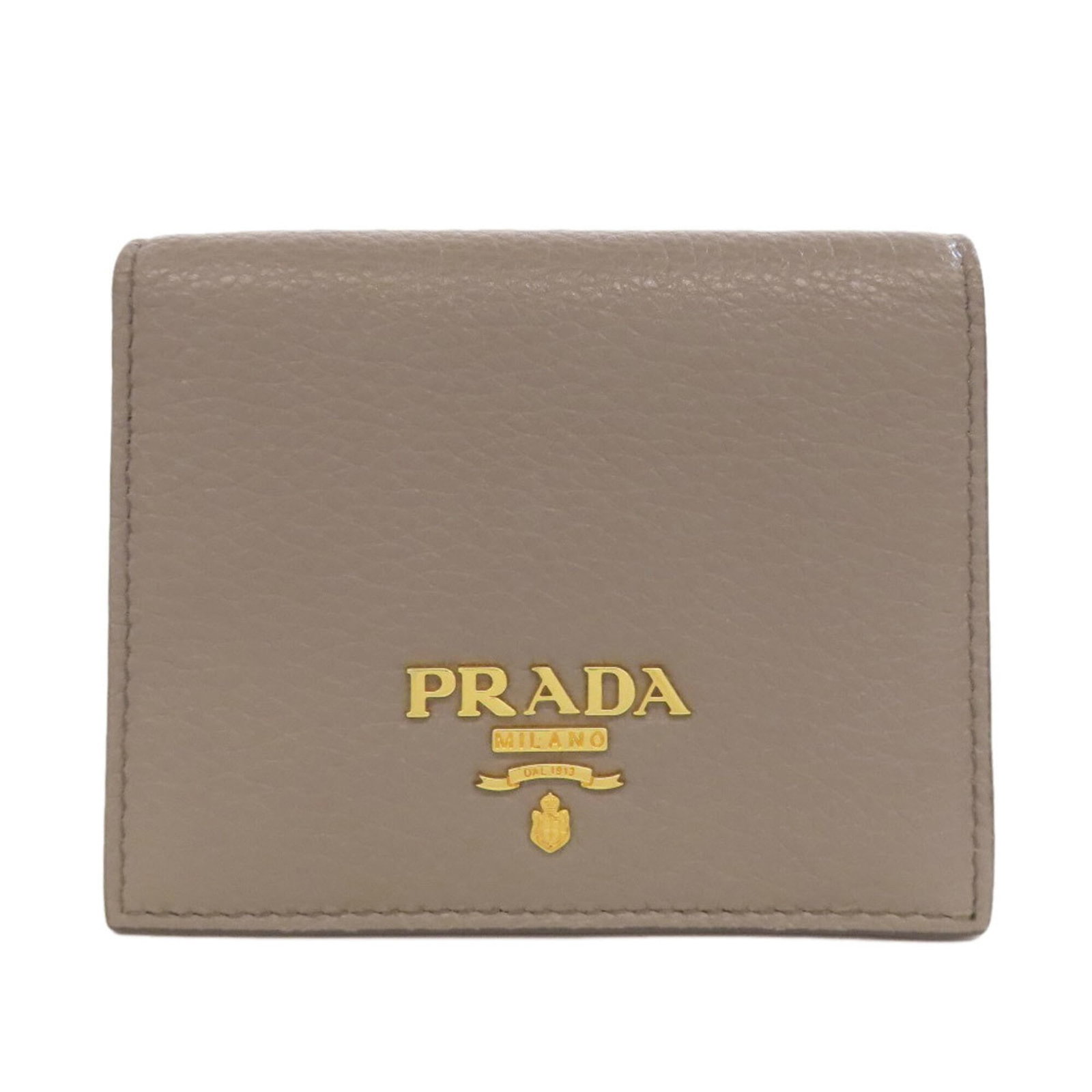 Prada Wallet (Bi-Fold) Leather: Prada Wallet (Bi-Fold) Leather Prada Bi-Fold Leather Wallet in Beige. This used Prada wallet features a classic bi-fold design made from high-quality leather, with a size of 9cm x 11cm x 2cm. With