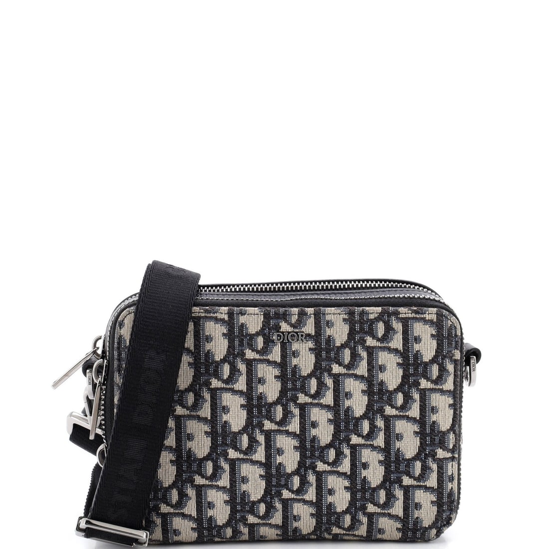 Double zip pouch canvas crossbody oblique Christian Dior: Double zip pouch canvas crossbody oblique Christian Dior Blue canvas crossbody bag with double zip pouch oblique design, featuring silver hardware and minor scuffs on exterior. The interior is lined i