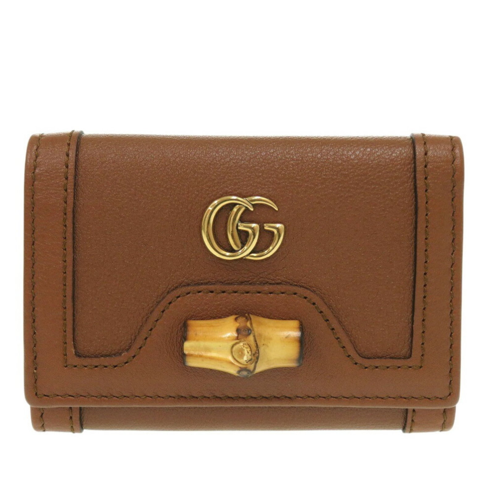 Gucci Wallet Leather Tri Fold: Gucci Wallet Leather Tri Fold Gucci Wallet Leather Tri Fold in Brown, with a classic tri-fold design and button closure. Made from high-quality leather, this wallet measures 7.5cm x 10.5cm x 3cm and f