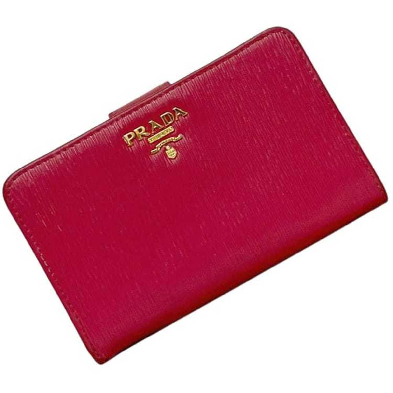 Prada Wallet (Bi-Fold) Leather: Prada Wallet (Bi-Fold) Leather Used Prada Bi-Fold Leather Wallet in Peonia Pink. This bi-fold wallet features high-quality leather and has a classic design, with some traces of usage visible due to