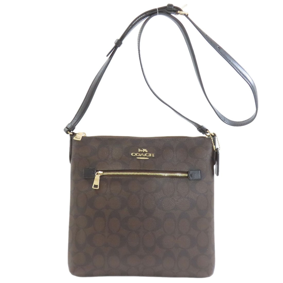 C1554 Signature Shoulder Bag Pvc: C1554 Signature Shoulder Bag Pvc The C1554 Signature Shoulder Bag Pvc boasts a striking brown exterior made from durable PVC material, adding a touch of modern sophistication to its classic design.