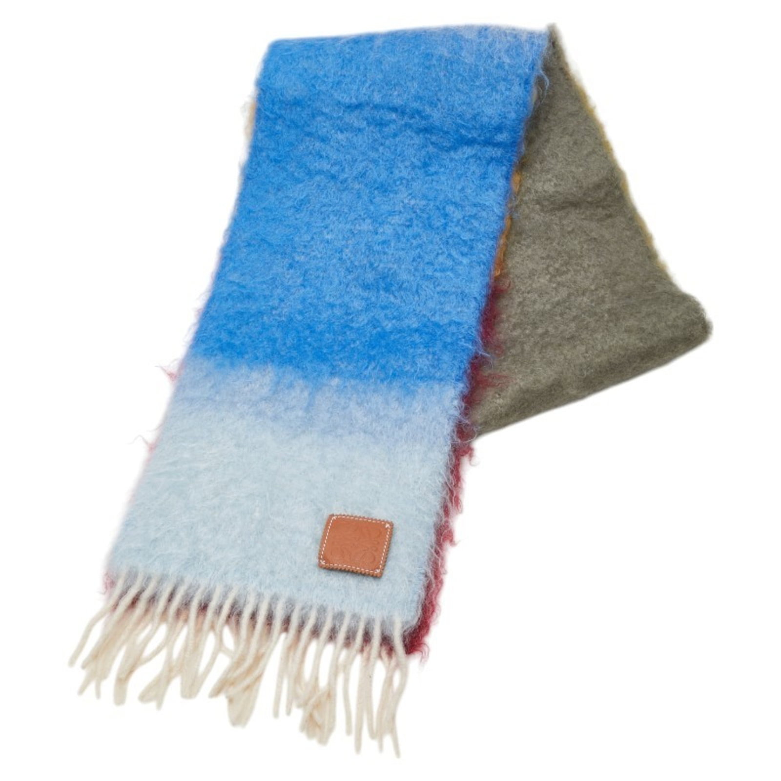 Stole Mohair Wool Loewe: Stole Mohair Wool Loewe Stole from the iconic Spanish fashion house Loewe, this multi-colored wool and mohair stole boasts a unique blend of textures and hues. With its subtle scratches and minor