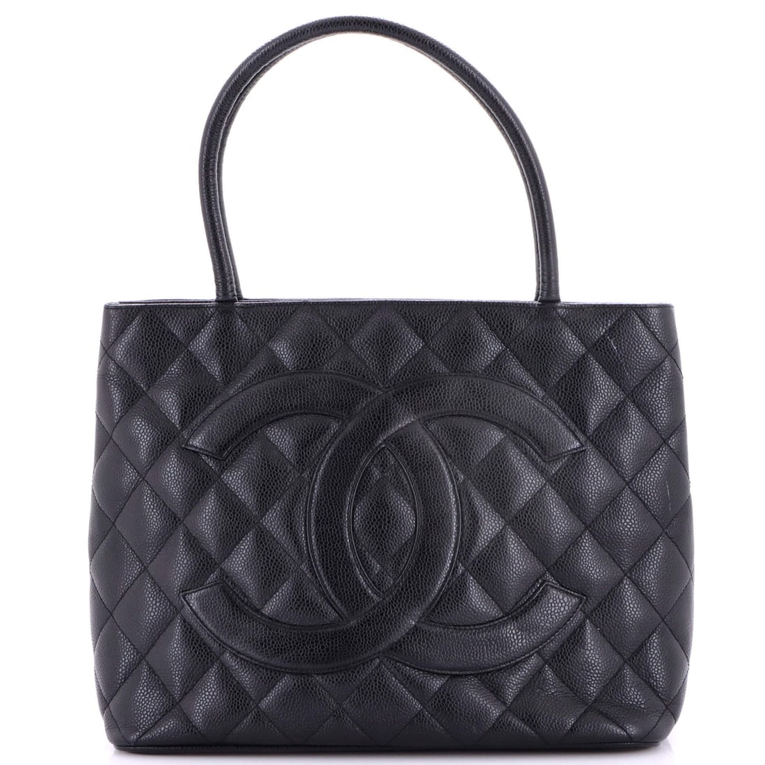 Medallion tote quilted caviar Chanel: Medallion tote quilted caviar Chanel The Medallion Tote Quilted Caviar Chanel features a striking black leather exterior with scuffs and minor edge wear, giving it a worn-in look. This quilted tote
