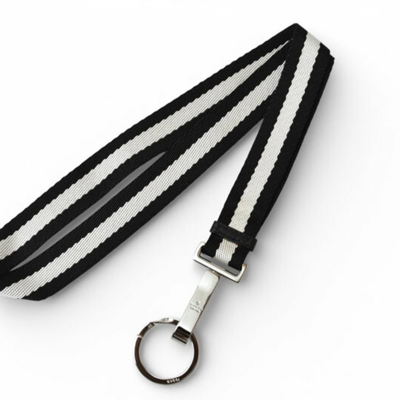 Gucci Others Nylon Metal: Gucci Others Nylon Metal Black and white nylon with metal accents, the Gucci Others features a sleek design. A used item in like new condition, it shows hardly any signs of wear. The black and white
