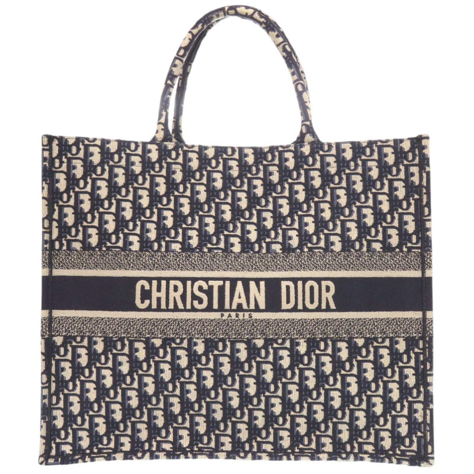 Canvas tote bag by Christian Dior: Canvas tote bag by Christian Dior Canvas tote bag by Christian Dior, featuring a classic beige and navy color combination. This pre-owned tote measures 35cm x 42cm x 18cm and boasts a sturdy canvas ma
