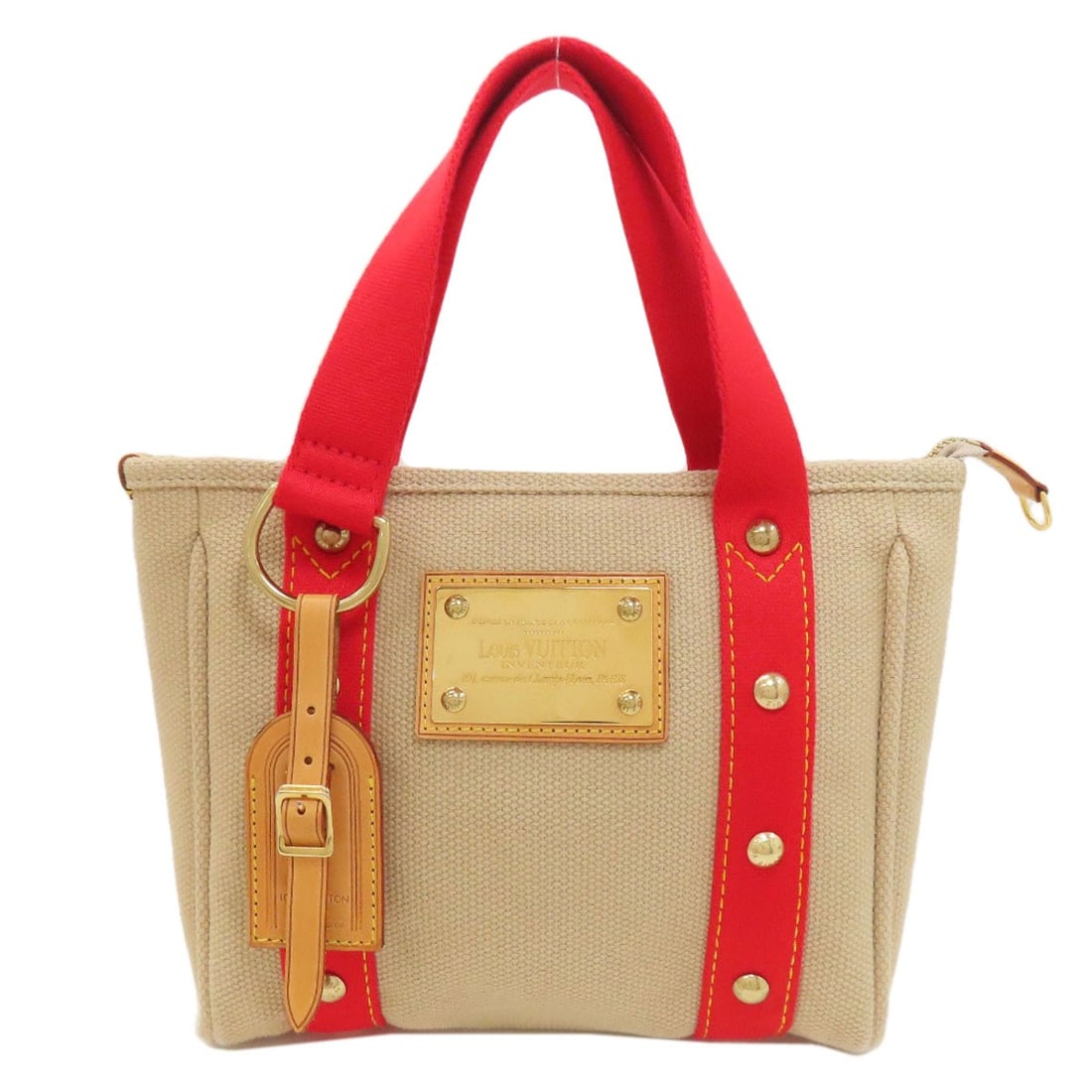 M40038 Louis Vuitton Canvas Antigua Kava Pm Handbag: M40038 Louis Vuitton Canvas Antigua Kava Pm Handbag Beige canvas Louis Vuitton Antigua Kava Pm handbag with signature. This classic design features the iconic monogram pattern and a timeless beige