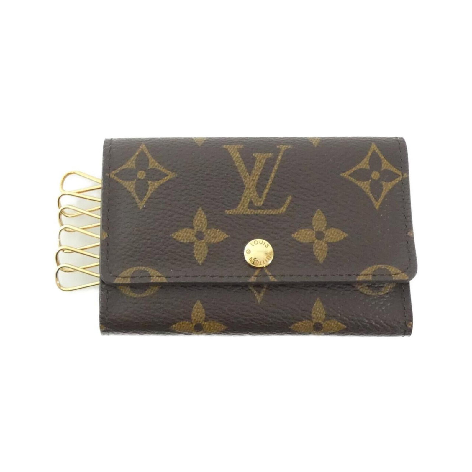 Monogram Keycase Louis Vuitton: Monogram Keycase Louis Vuitton Marron Monogram Louis Vuitton Keycase with 6 key hooks, bearing the iconic monogram pattern. This used keycase has some traces of usage and minor scratches/dirt, but
