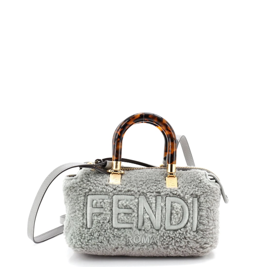 Shearling mini top bag by fendi logo handle: Shearling mini top bag by fendi logo handle Gray faux shearling mini top handle bag by Fendi, featuring a logo by the way design and gold hardware. The exterior has minor creases, while the interior