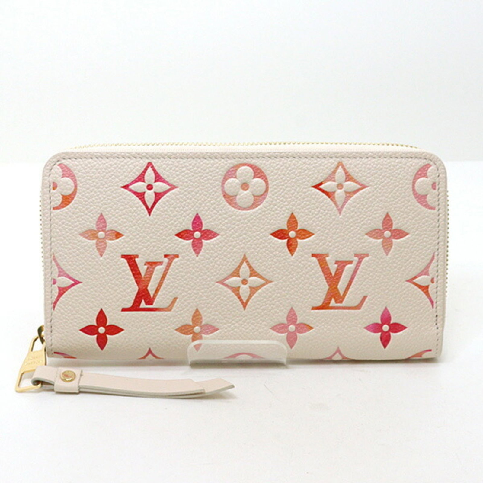 Vuitton Monogram Leather Bi Fold Long Wallet: Vuitton Monogram Leather Bi Fold Long Wallet Monogram Empreinte leather adds a touch of timeless elegance to this Vuitton bi-fold long wallet, featuring a sleek zipper closure and classic design.