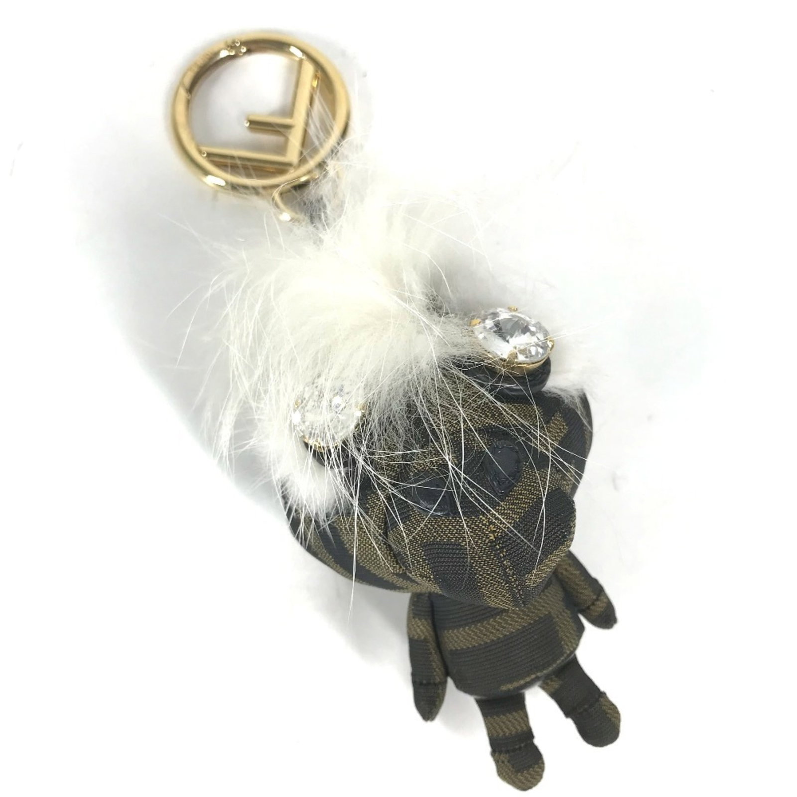 Canvas keyring Fendi: Canvas keyring Fendi Canvas keyring Fendi bears a signature. Made from canvas, this brown and khaki women's keyring has some scratches and dirt but remains in very good condition. A few traces of