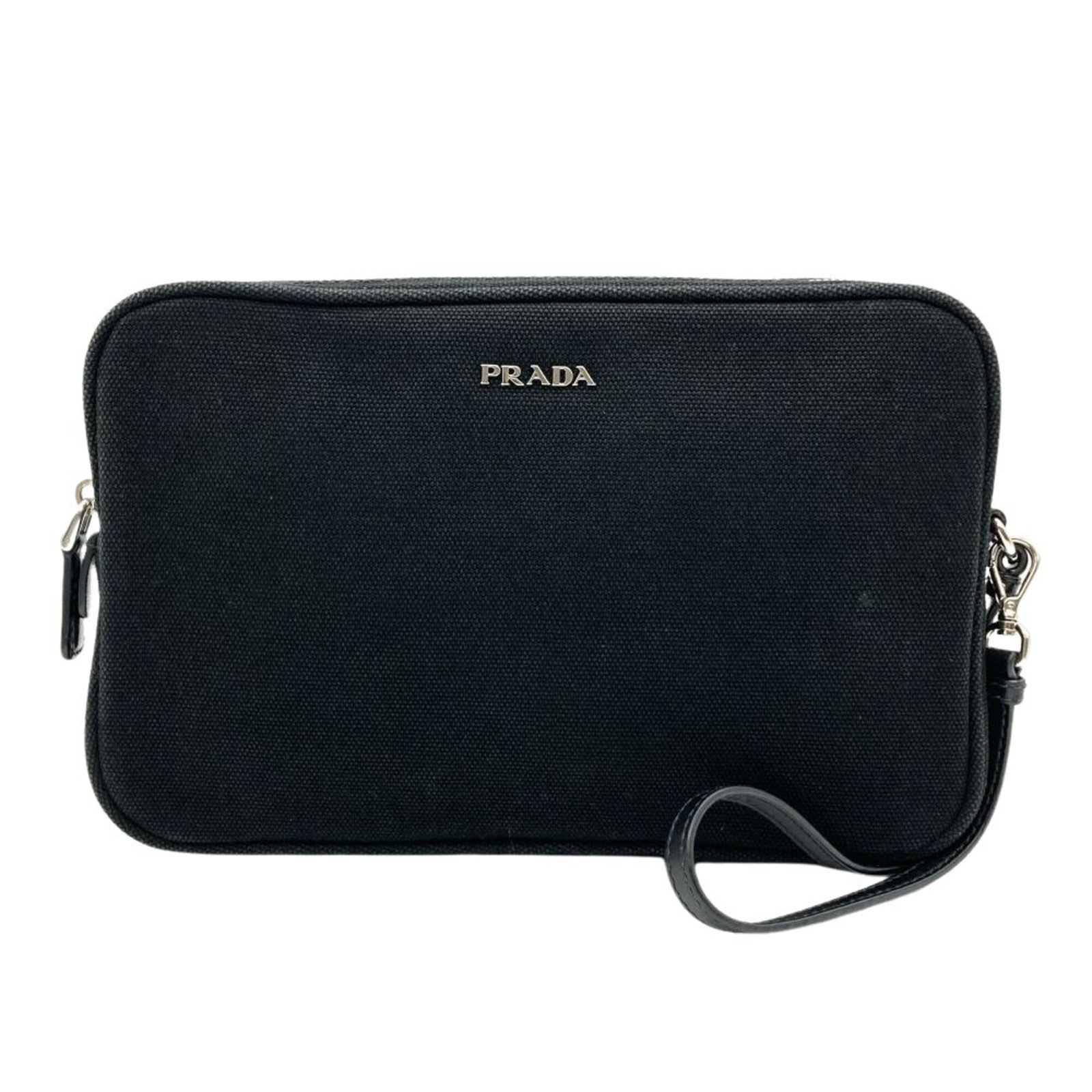 Handbag Pouch Prada Canvas: Handbag Pouch Prada Canvas Prada Canvas Handbag Pouch in Black. This used canvas handbag pouch features silver hardware and measures 14.5cm x 23cm x 4.5cm, showcasing a classic design with subtle