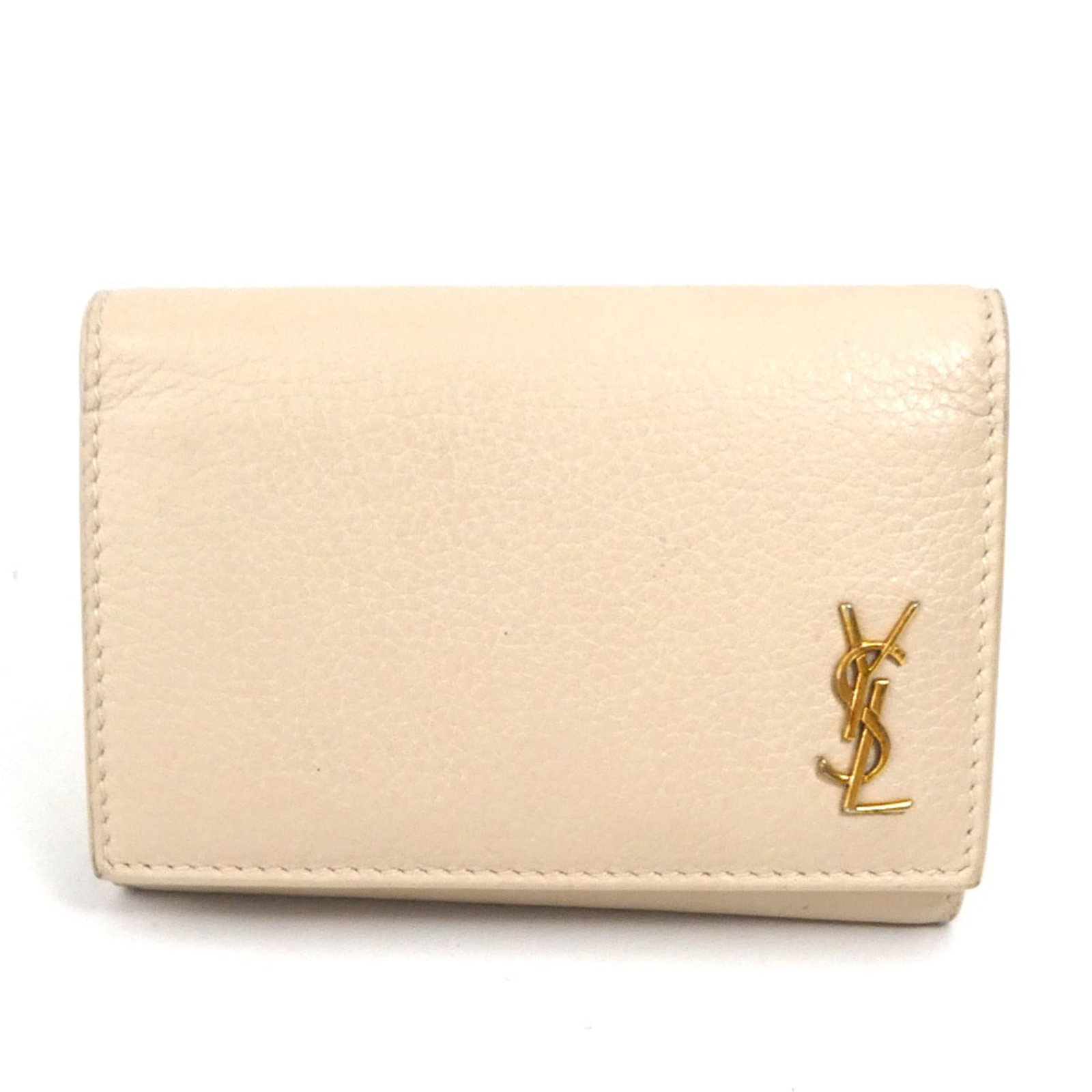 Keycase Leather by Saint Laurent: Keycase Leather by Saint Laurent Light Beige Saint Laurent Leather Keycase with Button Closure, featuring six key hooks made from high-quality leather. The item has traces of usage and minor