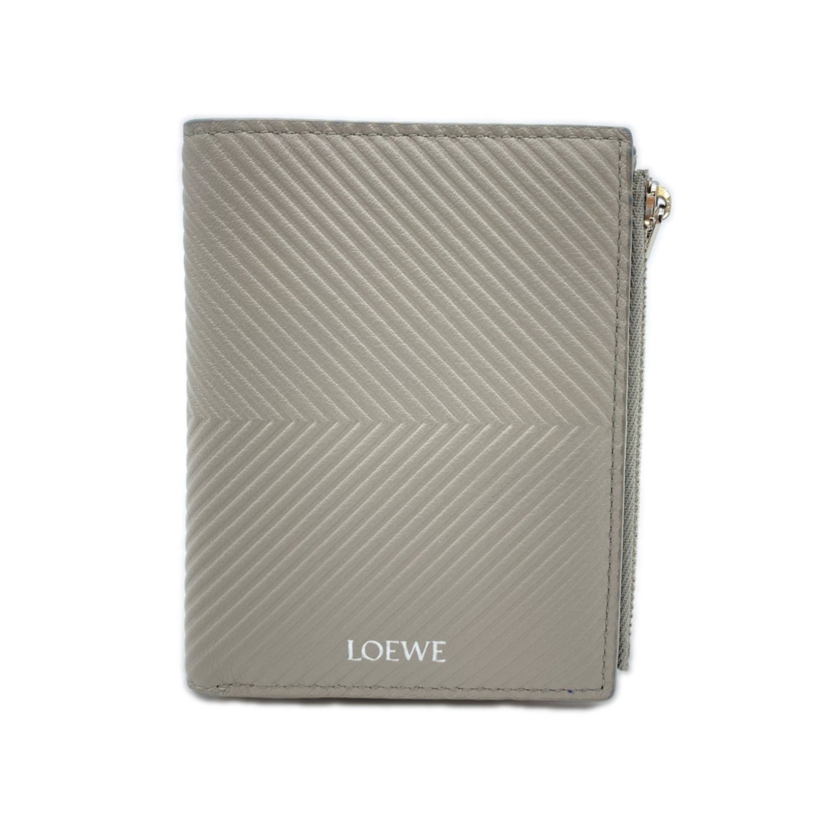 Loewe Wallet (Bi-Fold) Leather: Loewe Wallet (Bi-Fold) Leather This pre-owned Loewe bi-fold leather wallet features a classic gray color and durable construction, measuring 9.3cm x 11.8cm x 1cm. With its sturdy weight of 86g, it pro