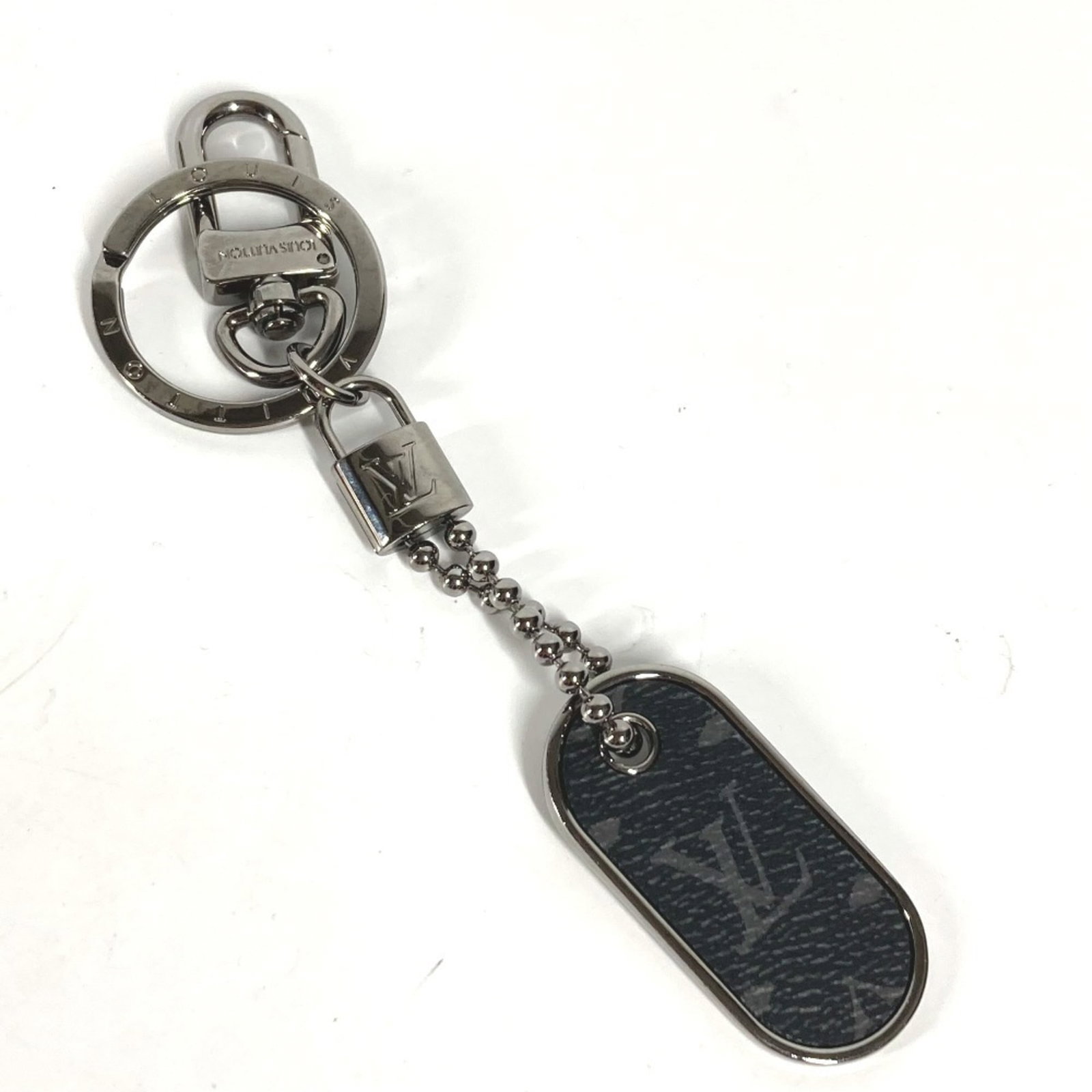 Vuitton Louis Monogram Keyring Eclipse: Vuitton Louis Monogram Keyring Eclipse The Louis Vuitton Louis Monogram Keyring Eclipse boasts iconic monogram patterns in black and Monogram Eclipse accents, adding an edgy touch to your keys. With a