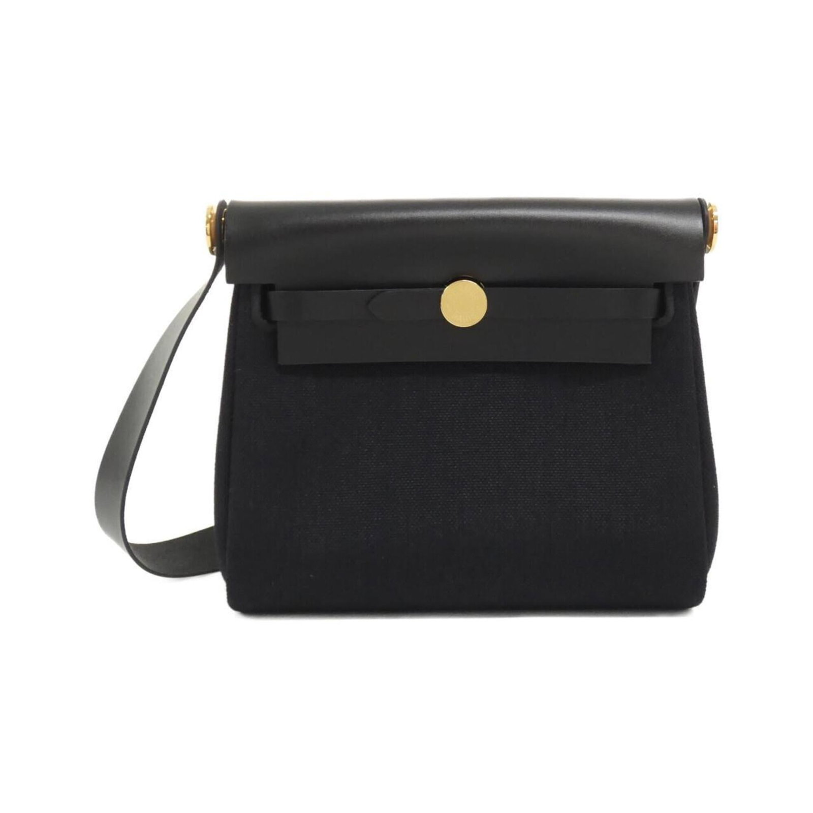 Shoulder Bag by Hermes: Shoulder Bag by Hermes Black gold hardware adds a touch of elegance to this classic shoulder bag by Hermes, featuring a timeless design with clean lines and a sophisticated black color. Made from