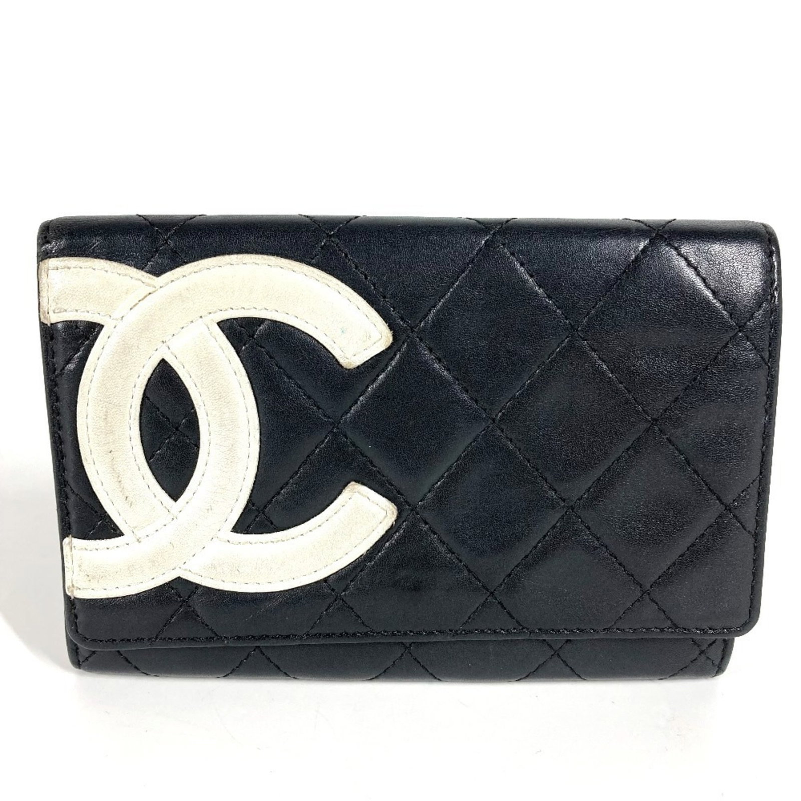 Chanel Long Wallet (Bi-Fold) Leather: Chanel Long Wallet (Bi-Fold) Leather The Chanel Long Wallet (Bi-Fold) Leather features classic design with a timeless black and white color scheme. With its bi-fold structure, it provides ample space