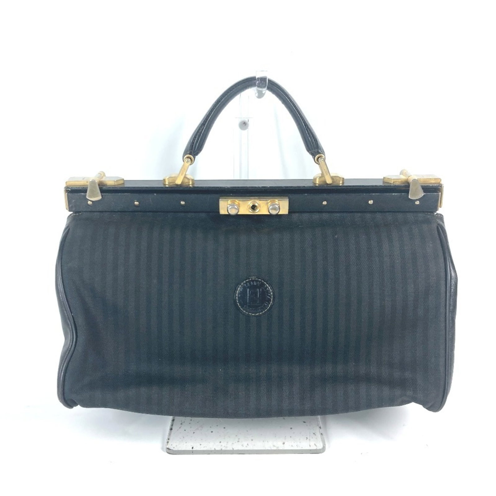 PVC Handbag Leather by Fendi: PVC Handbag Leather by Fendi Black PVC Handbag by Fendi features a sleek design with an open pocket and zipper pocket, perfect for everyday use. Made from high-quality leather and PVC materials, this