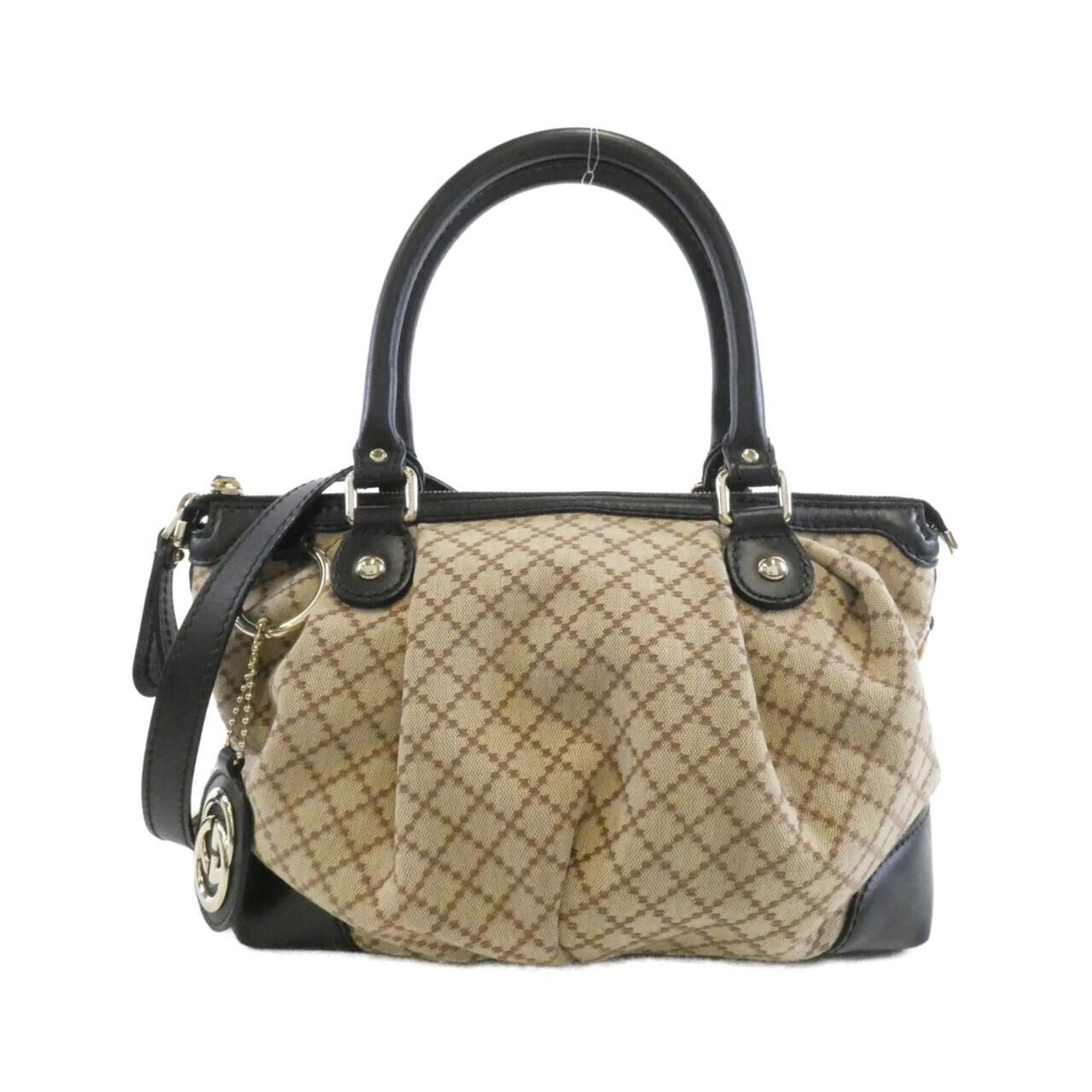 Gucci Handbag Shoulder Bag Canvas Leather: Gucci Handbag Shoulder Bag Canvas Leather Canvas and leather combine in this Gucci shoulder bag, offering a classic design in beige. The bag features some scratches and dirt from previous use, but