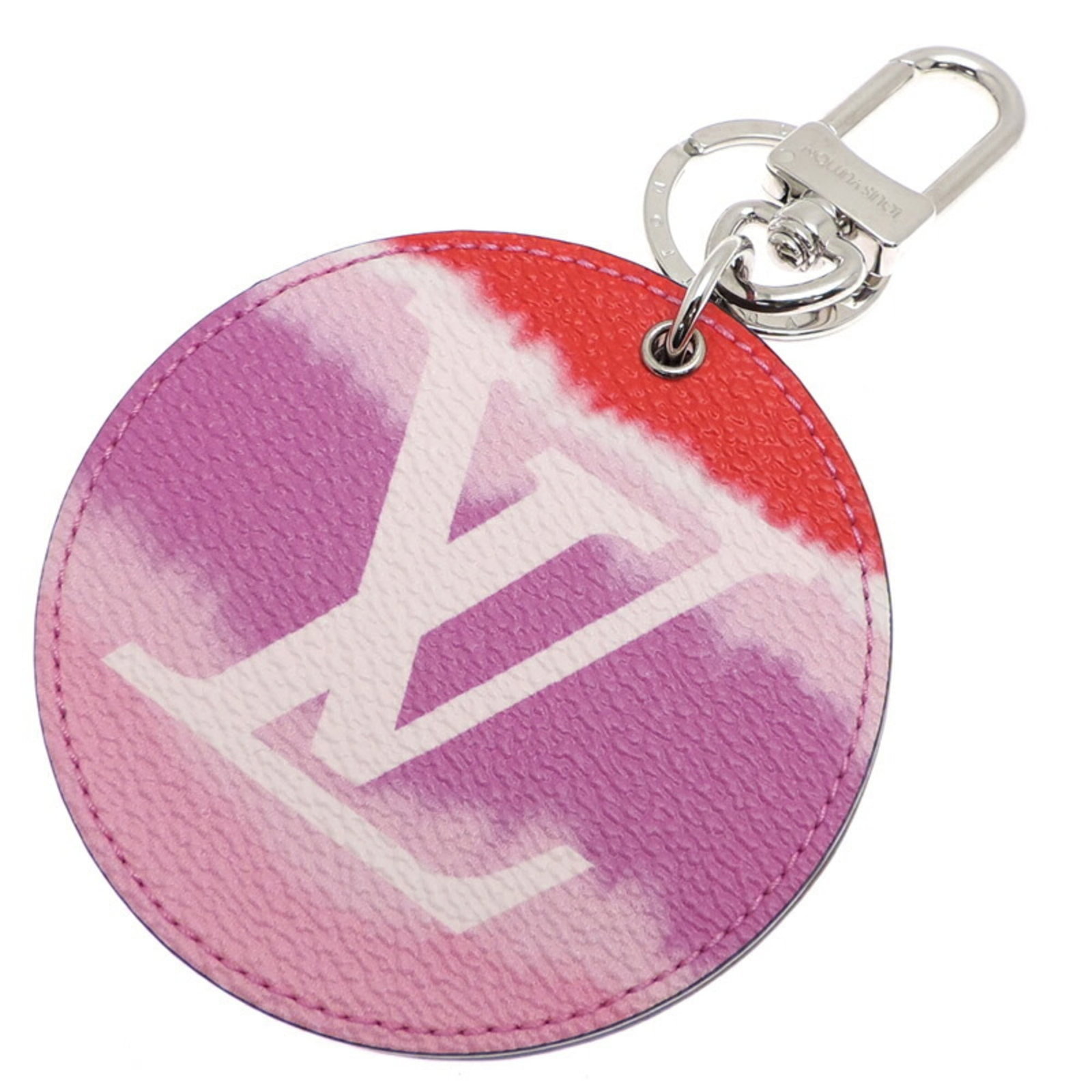 Keyring Monogram Louis Vuitton: Keyring Monogram Louis Vuitton This Louis Vuitton keyring features the iconic monogram pattern, showcasing a touch of pink. With some signs of wear and minor scratches, it remains in very good