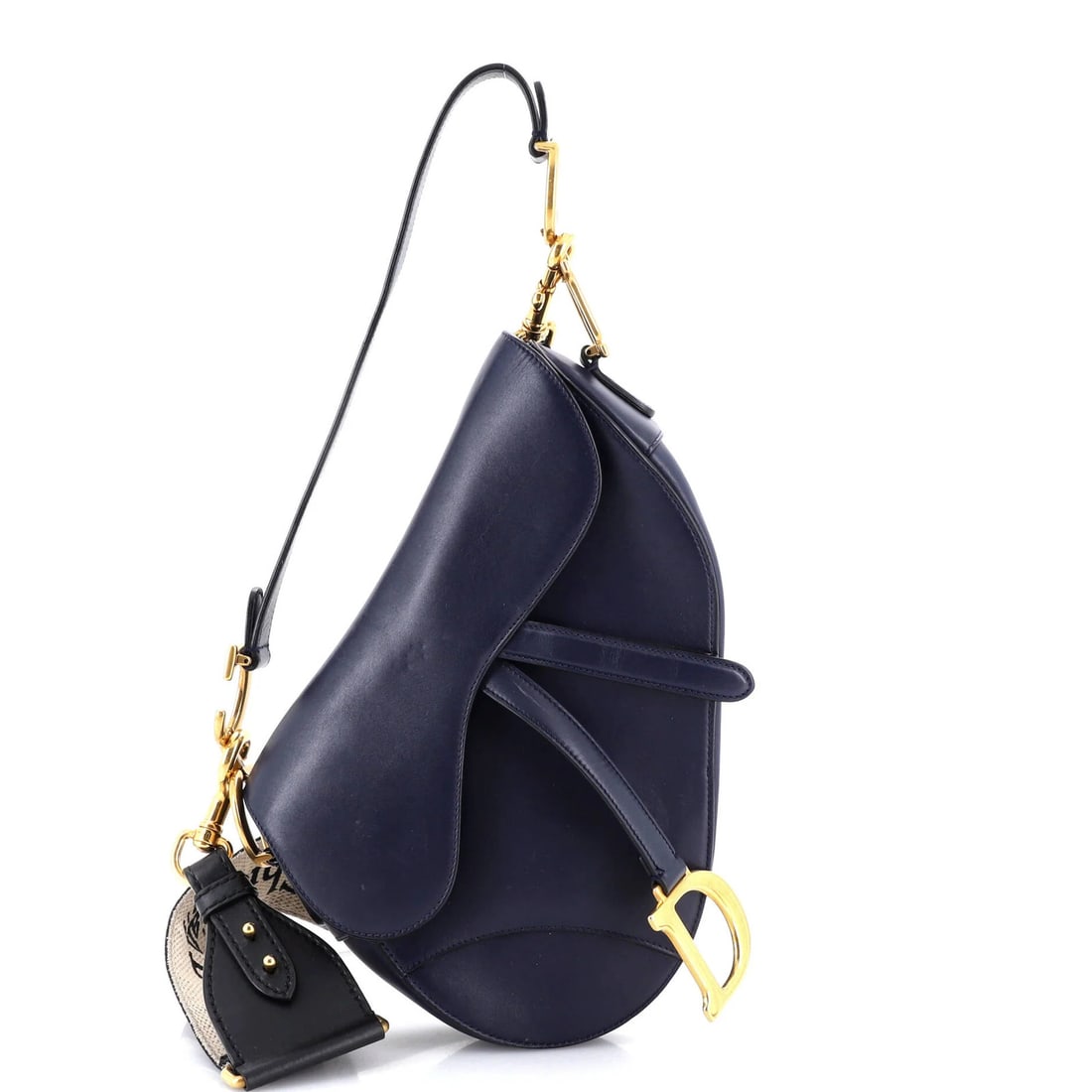 Dior Saddle Leather Handbag Medium Christian: Dior Saddle Leather Handbag Medium Christian The Dior Saddle Leather Handbag Medium Christian offers a stylish and versatile design. With its medium size, blue exterior, and gold hardware, this