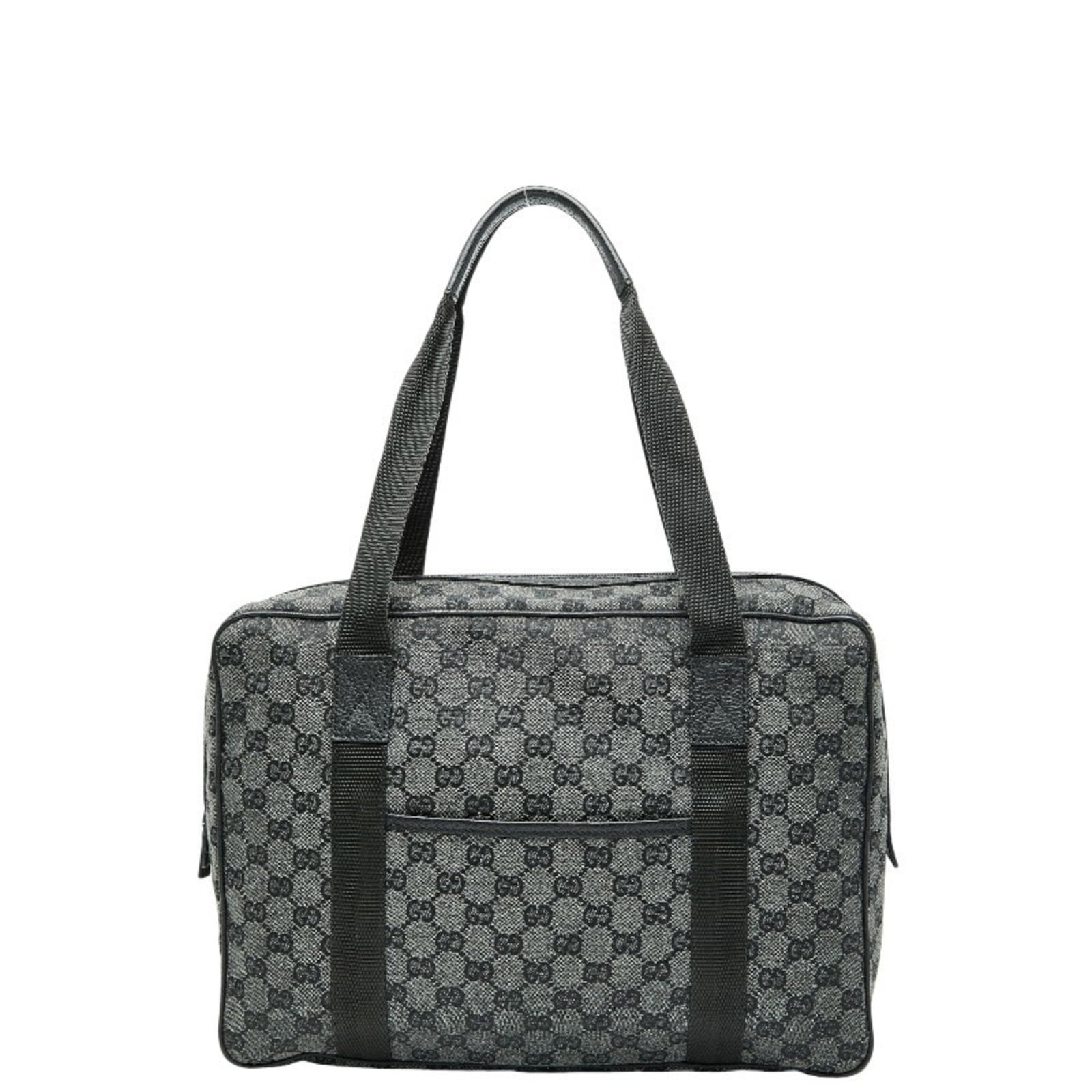 Canvas leather handbag: Canvas leather handbag Canvas leather handbag in black and gray, featuring a classic design with a canvas exterior and leather accents. Measuring 25cm x 33cm x 10cm, it has a worn look with traces of