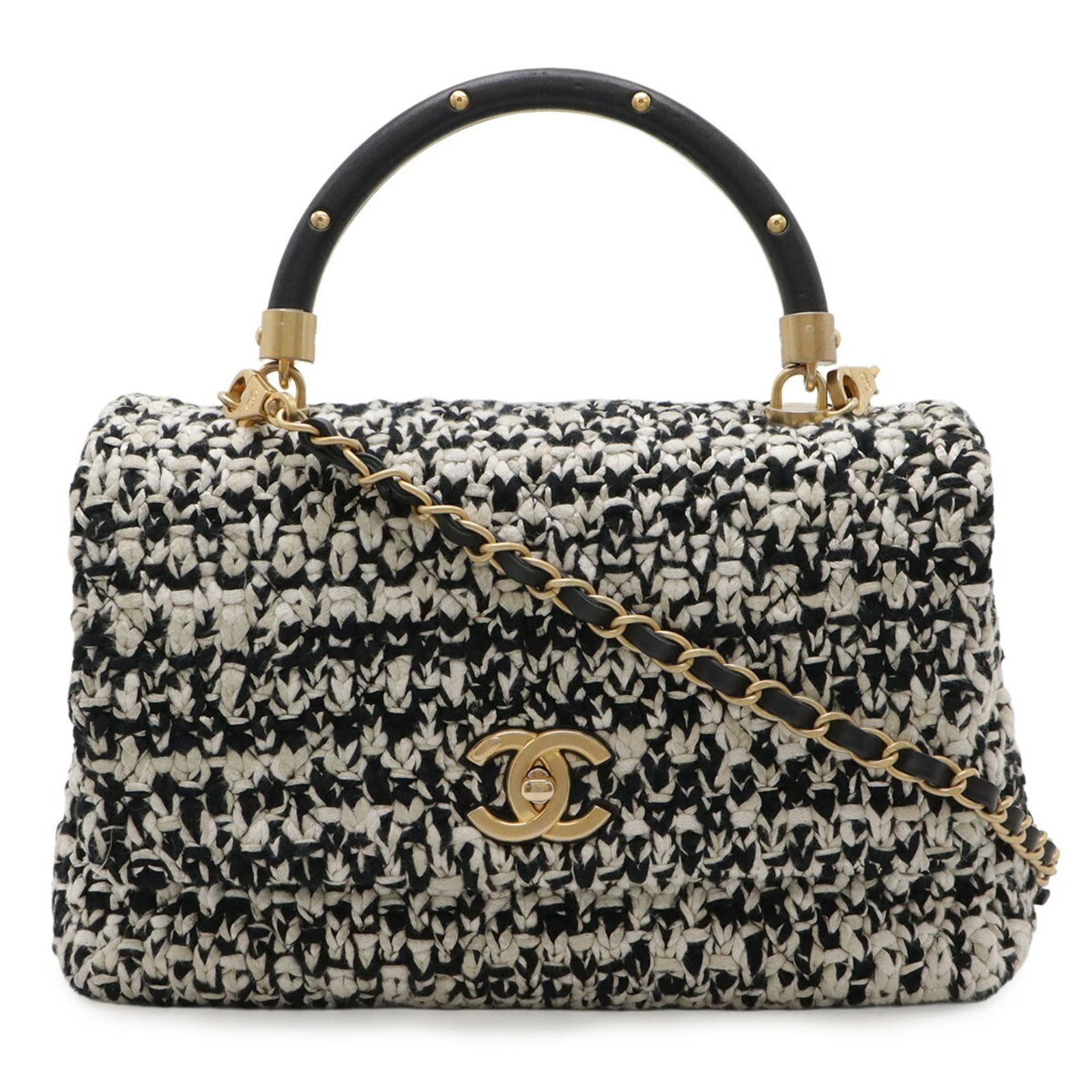 Handbag Tweed Leather Chanel Shoulder Bag: Handbag Tweed Leather Chanel Shoulder Bag Tweed and leather blend in this classic Chanel shoulder bag, with black and white tones creating a timeless look. Measuring 17cm x 29cm x 11.5cm, it's a compa