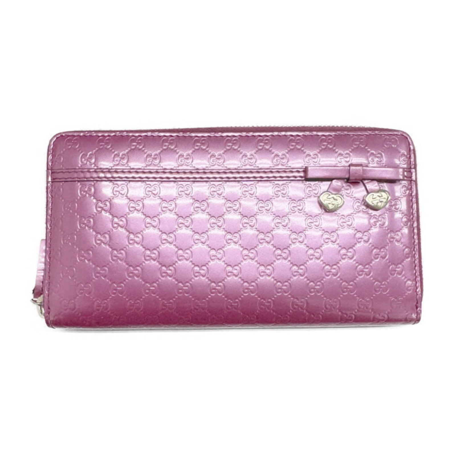 Patent leather wallet bi fold from Gucci: Patent leather wallet bi fold from Gucci Patent leather wallet bi-fold from Gucci, featuring a striking pink or purple hue. Made from high-quality patent leather, this long wallet boasts a sleek