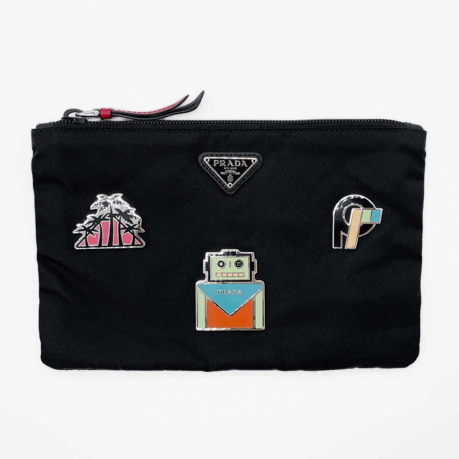 Nylon Prada Pouch Bag Clutch: Nylon Prada Pouch Bag Clutch Black nylon Prada pouch clutch with a sleek, compact design. Measuring 14.5cm x 22cm x 1cm, it features a sturdy construction and a few traces of usage that add to its