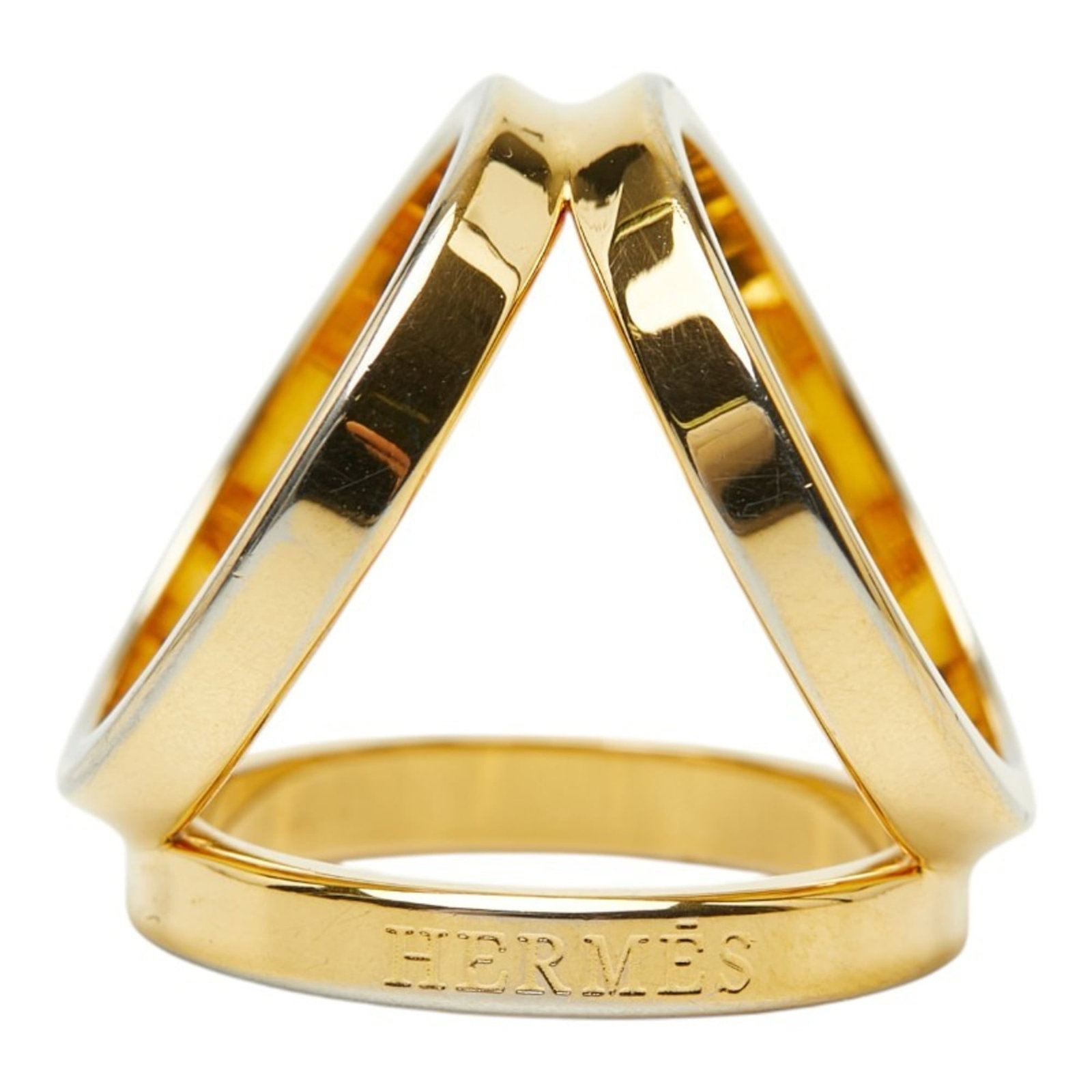 Metal ring scarf by Hermes: Metal ring scarf by Hermes Gold metal ring scarf by Hermes, featuring a delicate design with traces of usage and minor scratches. The scarf bears a signature but its origin remains unknown. In good