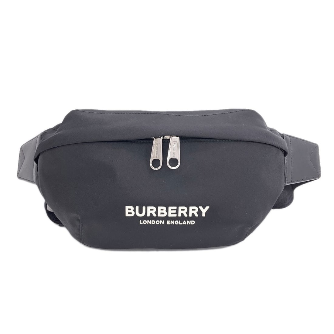 Burberry body bag nylon bum: Burberry body bag nylon bum Black nylon body bag with Burberry branding. Made from durable nylon, this style features a sleek design and black exterior color. The signature bears a mark on the item. I