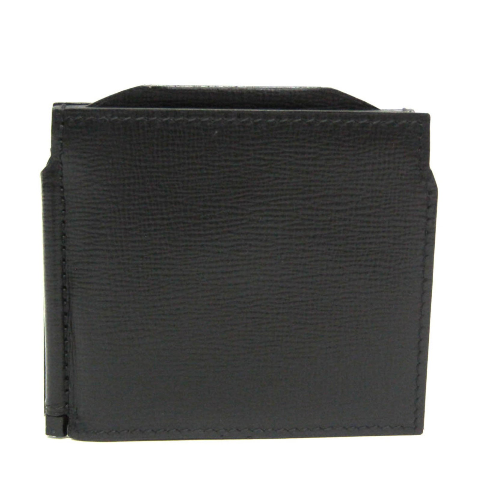 Money clip leather Valextra: Money clip leather Valextra This black leather Valextra money clip has a classic design and a sturdy construction, with a size of 8.5cm x 10cm. It features a few traces of usage, some scratches and