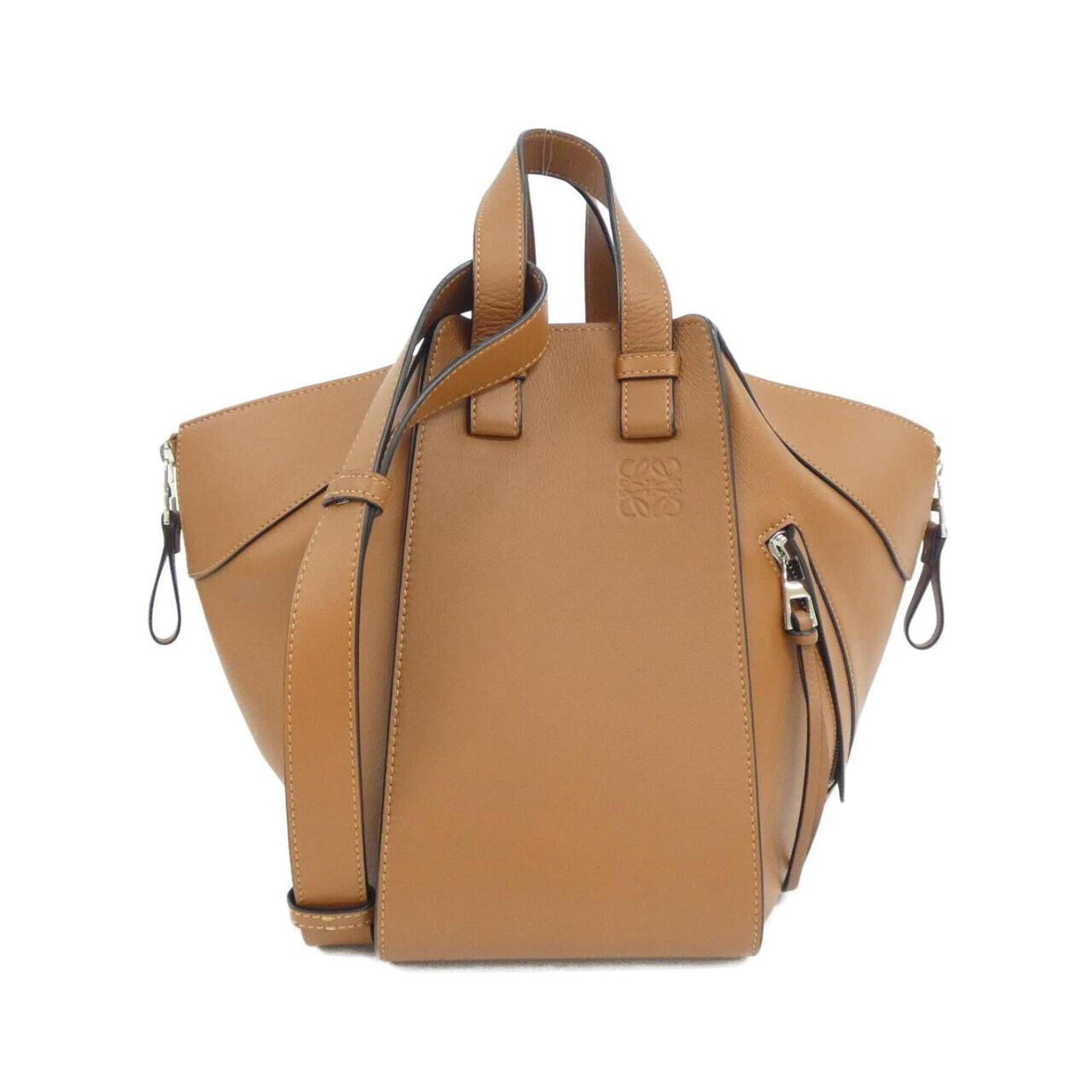 Shoulder Bag Leather by Loewe: Shoulder Bag Leather by Loewe The Loewe shoulder bag features rich, brown calfskin leather and silver hardware, adding a touch of sophistication to its classic design. With a few traces of usage visib