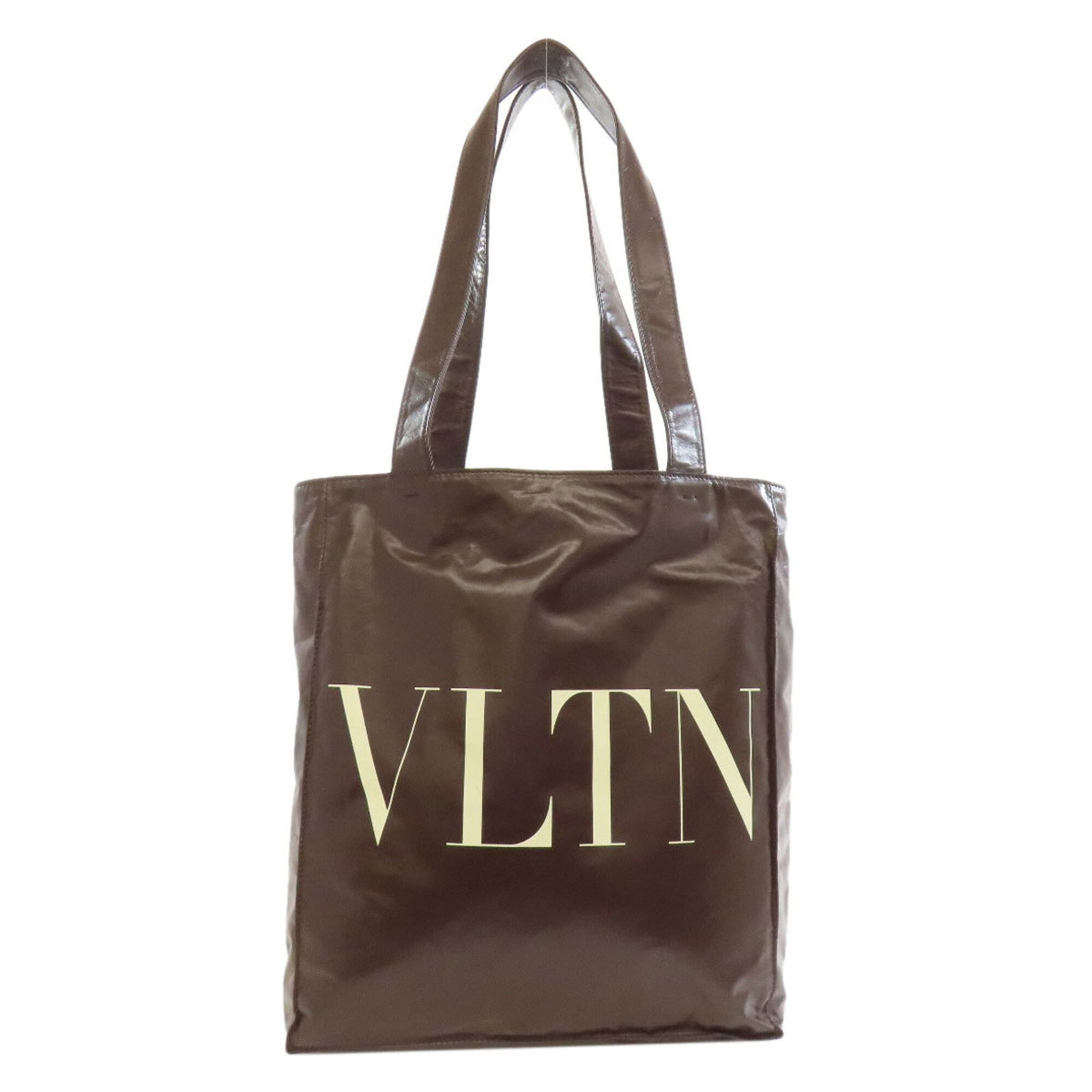 Valentino Tote Bag Leather: Valentino Tote Bag Leather Valentino's iconic tote bag features rich, supple leather made from high-quality calfskin. The timeless design boasts a classic brown color and sturdy dimensions, making it