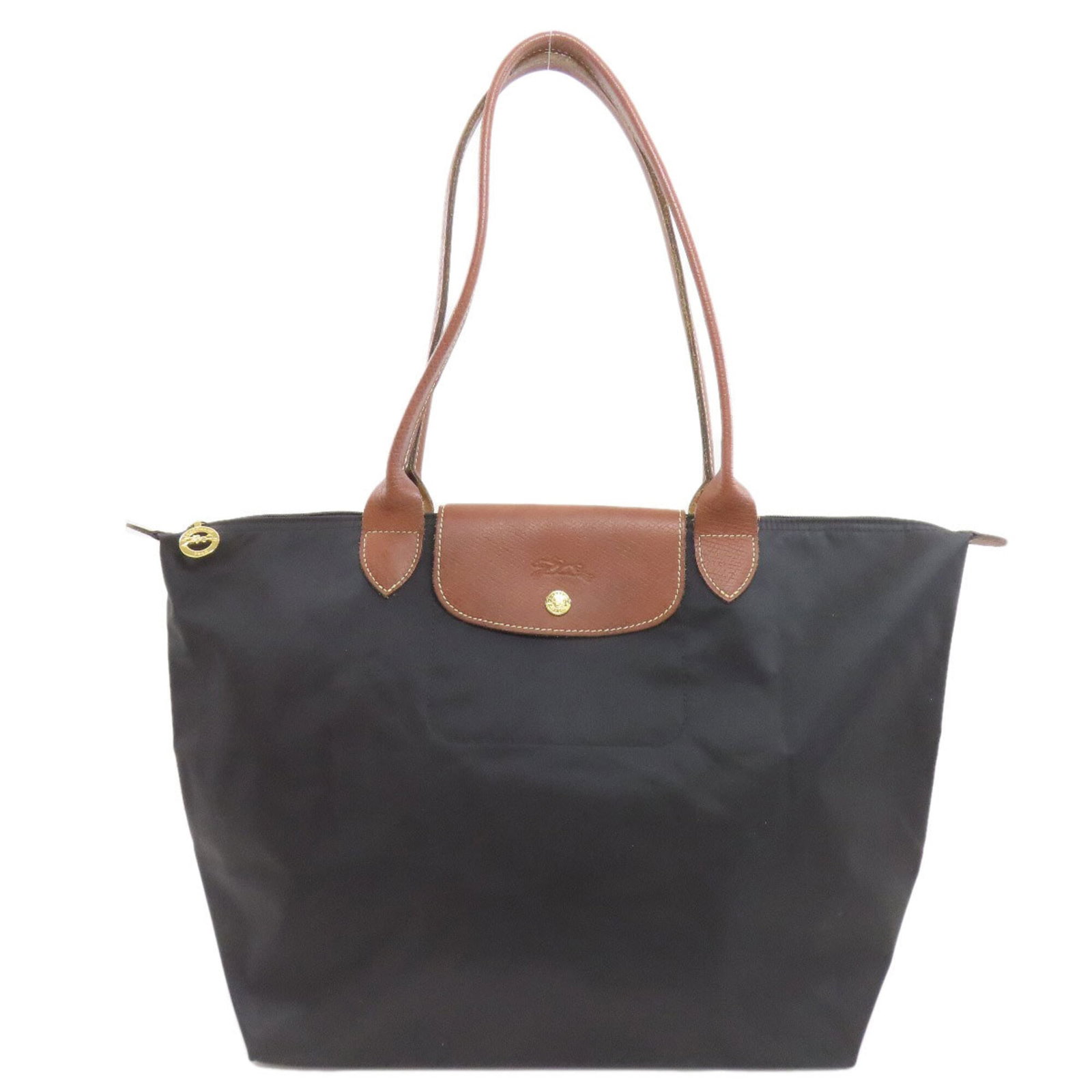 Nylon Longchamp Tote Bag: Nylon Longchamp Tote Bag Black Nylon Longchamp Tote Bag, 29.5cm x 50cm x 19cm, with traces of usage and minor scratches / dirt, in good condition. Made from durable nylon material, this tote bag