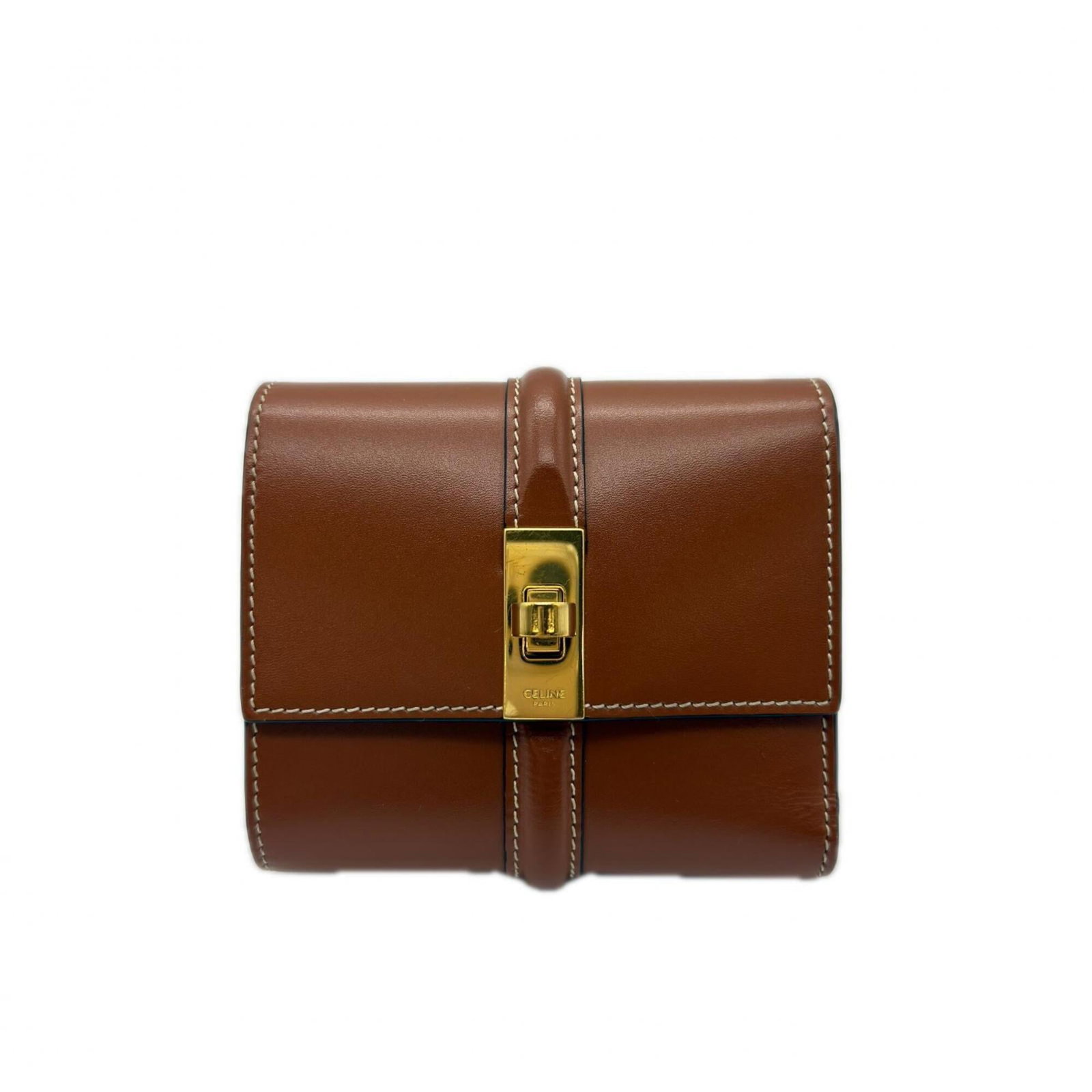 Celine Tri Fold Leather: Celine Tri Fold Leather Calfskin Celine Tri Fold Leather Wallet for Women. This brown leather wallet features a classic tri-fold design with a turn lock closure, measuring 8cm x 10.5cm x 3.5cm. With t