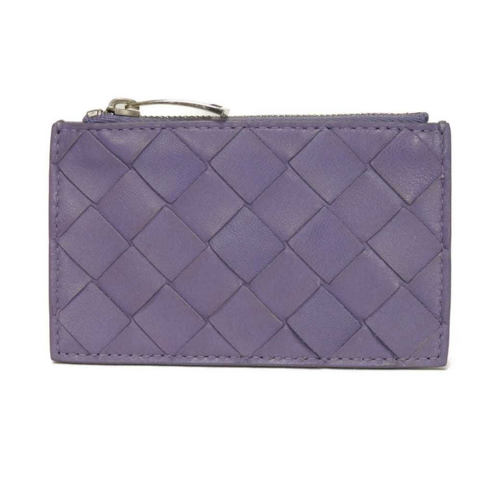 Bottega Veneta Coin Purse/ Coin Case Intrecciato: Bottega Veneta Coin Purse/ Coin Case Intrecciato This Bottega Veneta Intrecciato coin purse features the iconic woven pattern and rich purple hue, adding a touch of elegance to any outfit. Made from