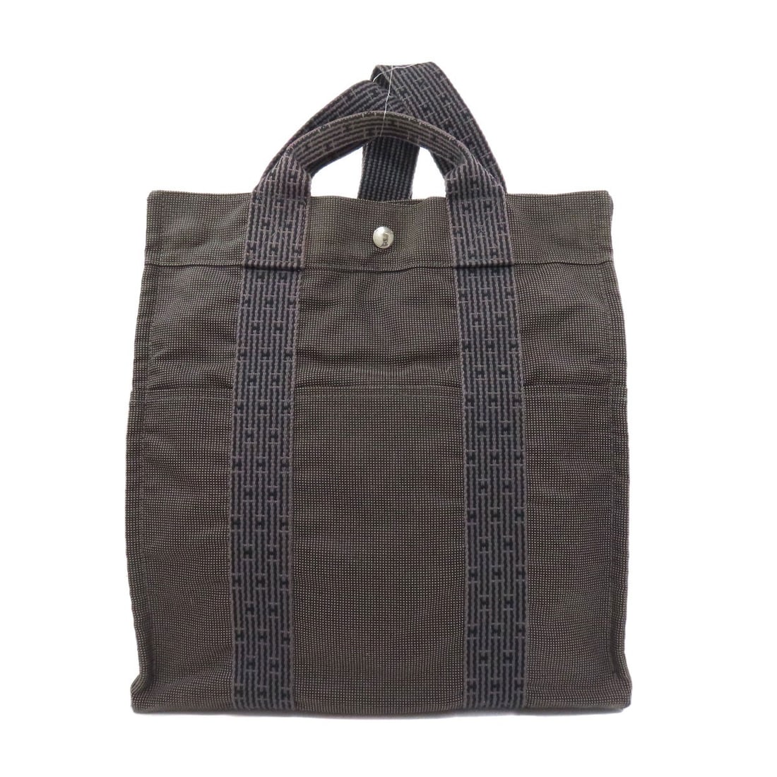 Hermes Her Line Ad Mm Handbag Canvas: Hermes Her Line Ad Mm Handbag Canvas This gray canvas handbag from Hermes' Her Line features a classic design with a timeless appeal. Made from high-quality canvas, it boasts a versatile and stylish